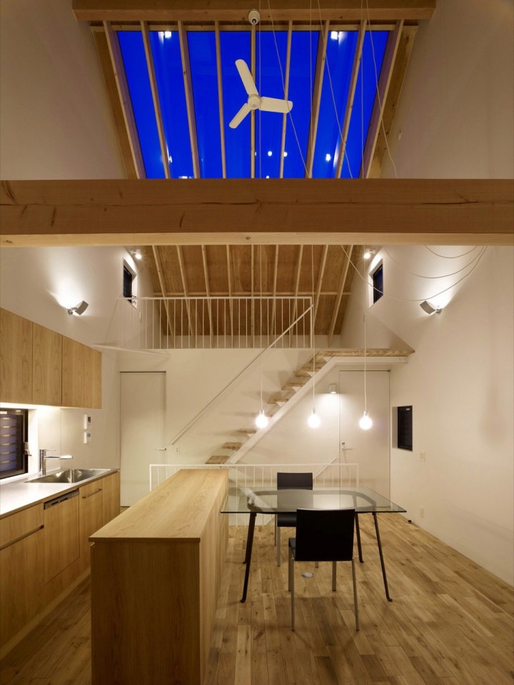 With neighbors close by and no good views, this small house has few windows. Instead, a huge skylight floods the living space with daylight. The house has two bedrooms and a loft in 807 sq ft. | www.facebook.com/SmallHouseBliss