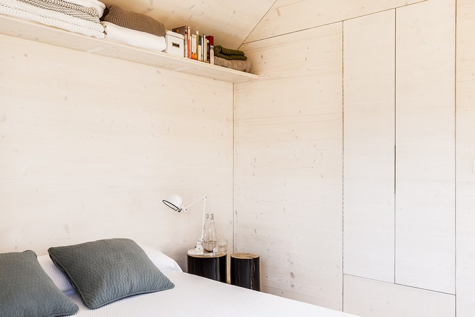 The ÁPH80 Transportable House, a tiny prefab with a minimalist design aesthetic, has one bedroom in 291 sq ft. | www.facebook.com/SmallHouseBliss