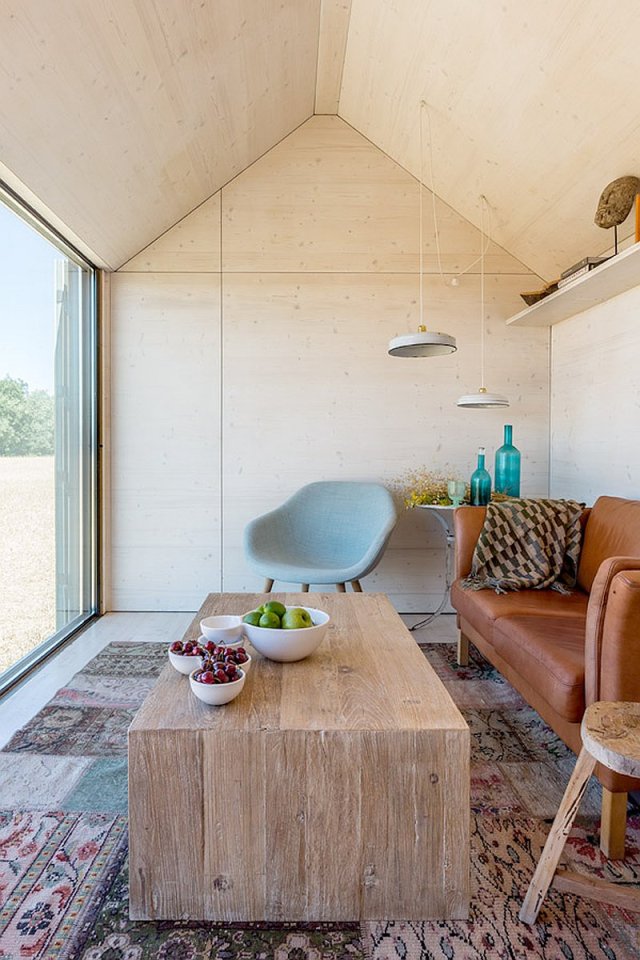 The ÁPH80 Transportable House, a tiny prefab with a minimalist design aesthetic, has one bedroom in 291 sq ft. | www.facebook.com/SmallHouseBliss