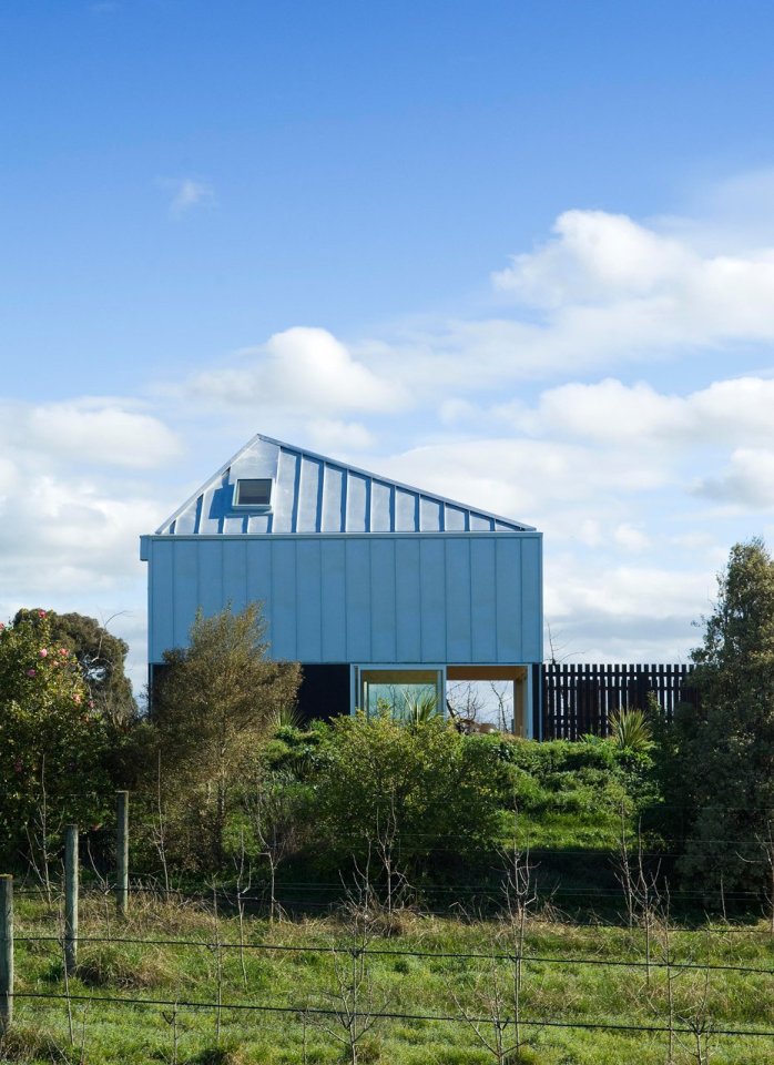 A musician's bachelor pad sits in the middle of an apple orchard. It has one bedroom and a study in 861 sq ft. | www.facebook.com/SmallHouseBliss