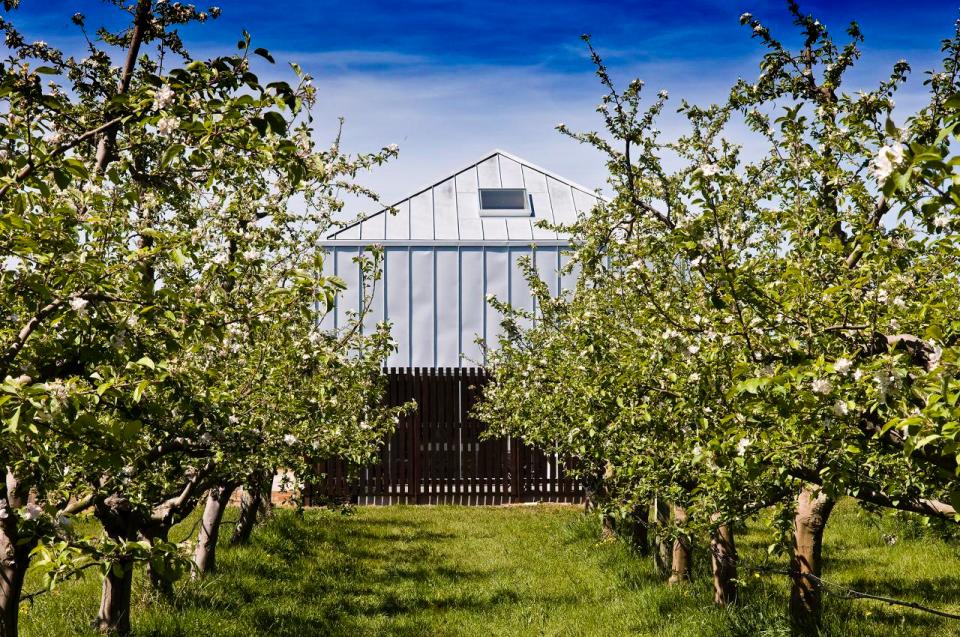 A musician's bachelor pad sits in the middle of an apple orchard. It has one bedroom and a study in 861 sq ft. | www.facebook.com/SmallHouseBliss
