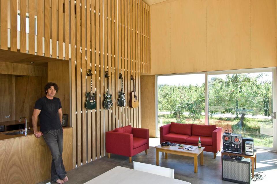 A musician's bachelor pad sits in the middle of an apple orchard. It has one bedroom and a study in 861 sq ft. | www.facebook.com/SmallHouseBliss