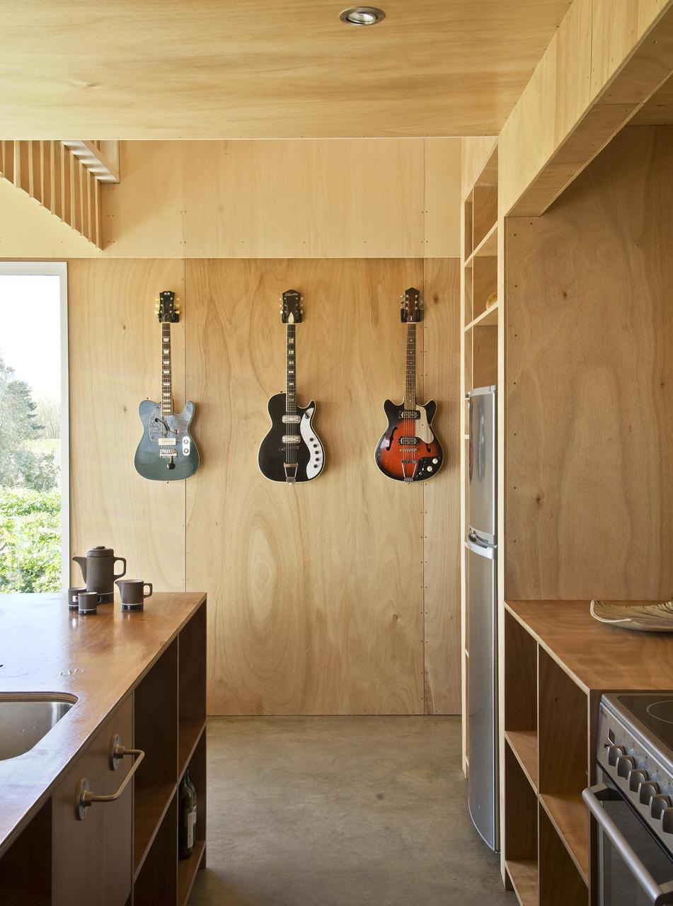 A musician's bachelor pad sits in the middle of an apple orchard. It has one bedroom and a study in 861 sq ft. | www.facebook.com/SmallHouseBliss