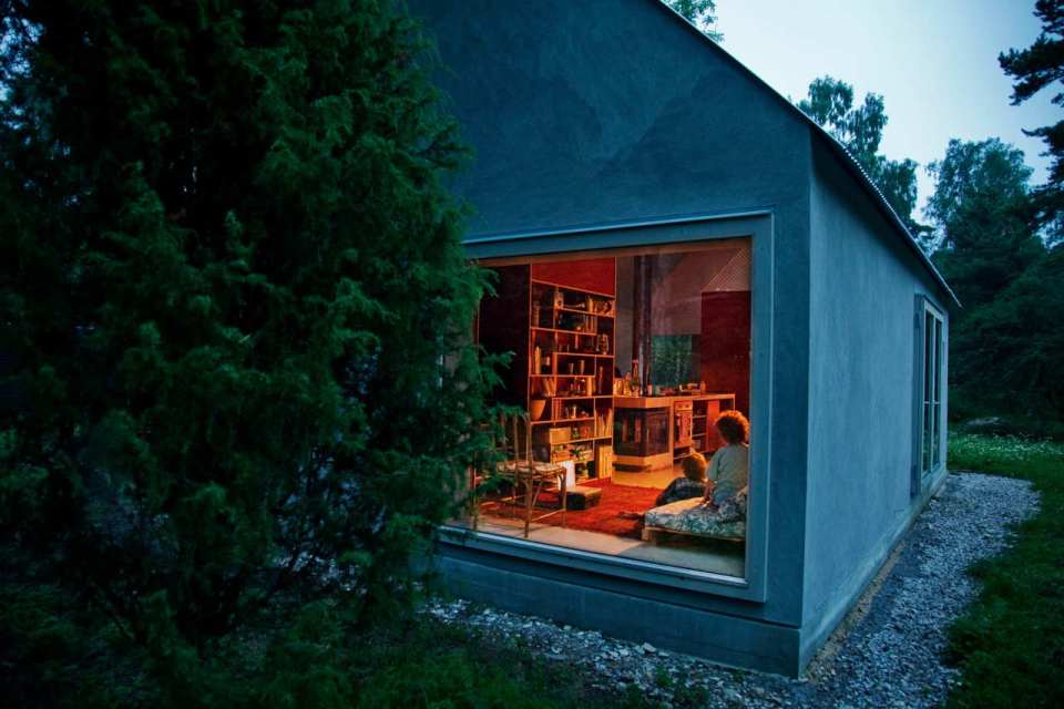 This small summer house in Sweden was inspired by local barns. It has an open interior with two sleeping spaces in 689 sq ft. Straightforward design and simple materials kept the cost down. | www.facebook.com/SmallHouseBliss