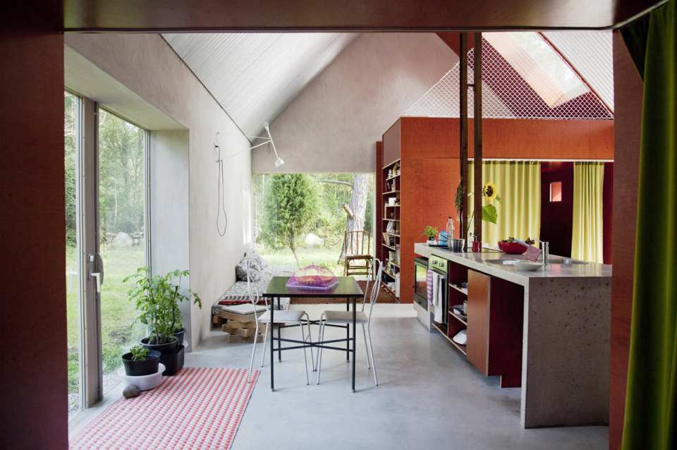This small summer house in Sweden was inspired by local barns. It has an open interior with two sleeping spaces in 689 sq ft. Straightforward design and simple materials kept the cost down. | www.facebook.com/SmallHouseBliss