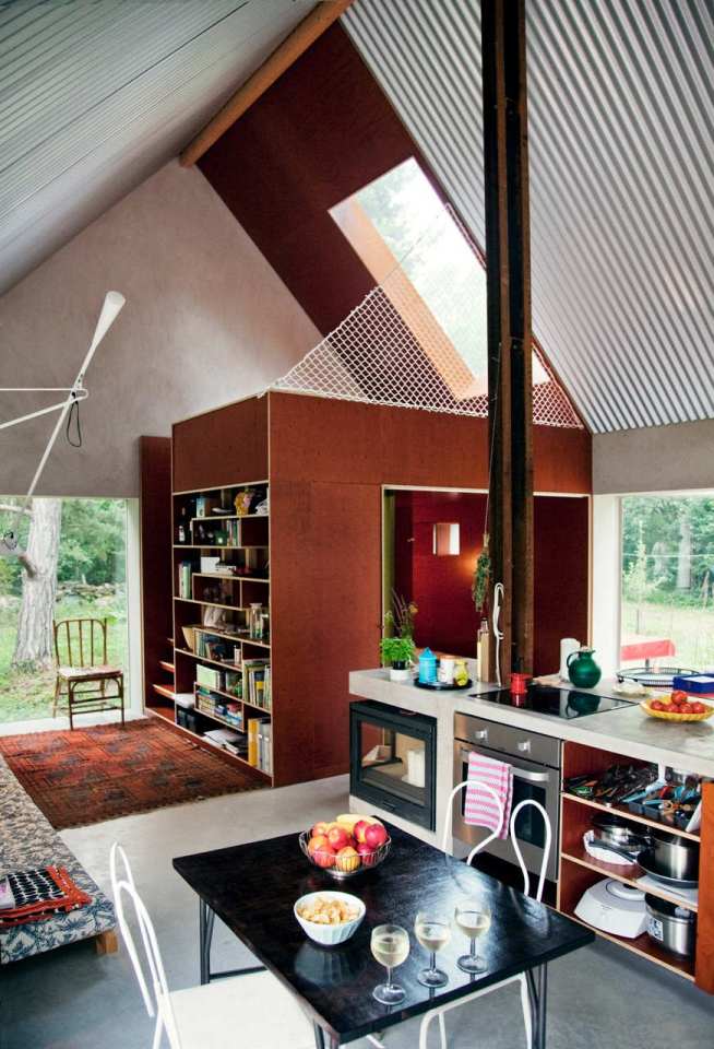 This small summer house in Sweden was inspired by local barns. It has an open interior with two sleeping spaces in 689 sq ft. Straightforward design and simple materials kept the cost down. | www.facebook.com/SmallHouseBliss