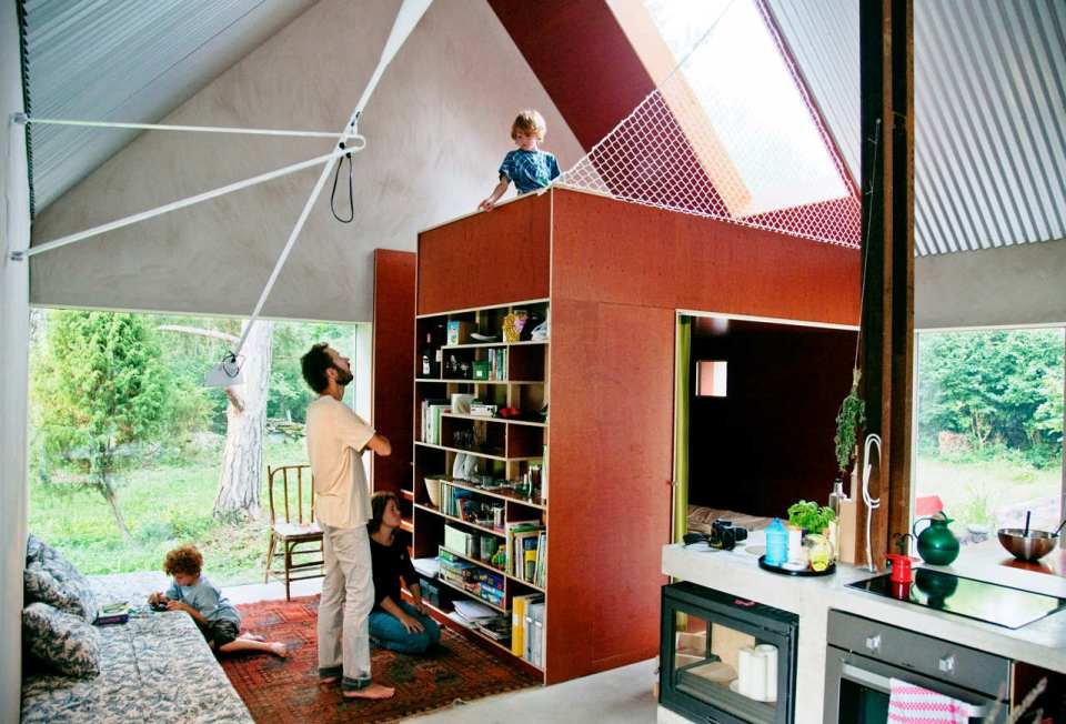 This small summer house in Sweden was inspired by local barns. It has an open interior with two sleeping spaces in 689 sq ft. Straightforward design and simple materials kept the cost down. | www.facebook.com/SmallHouseBliss