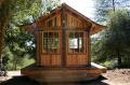 Tea house cabin in the woods by Molecule Tiny Homes