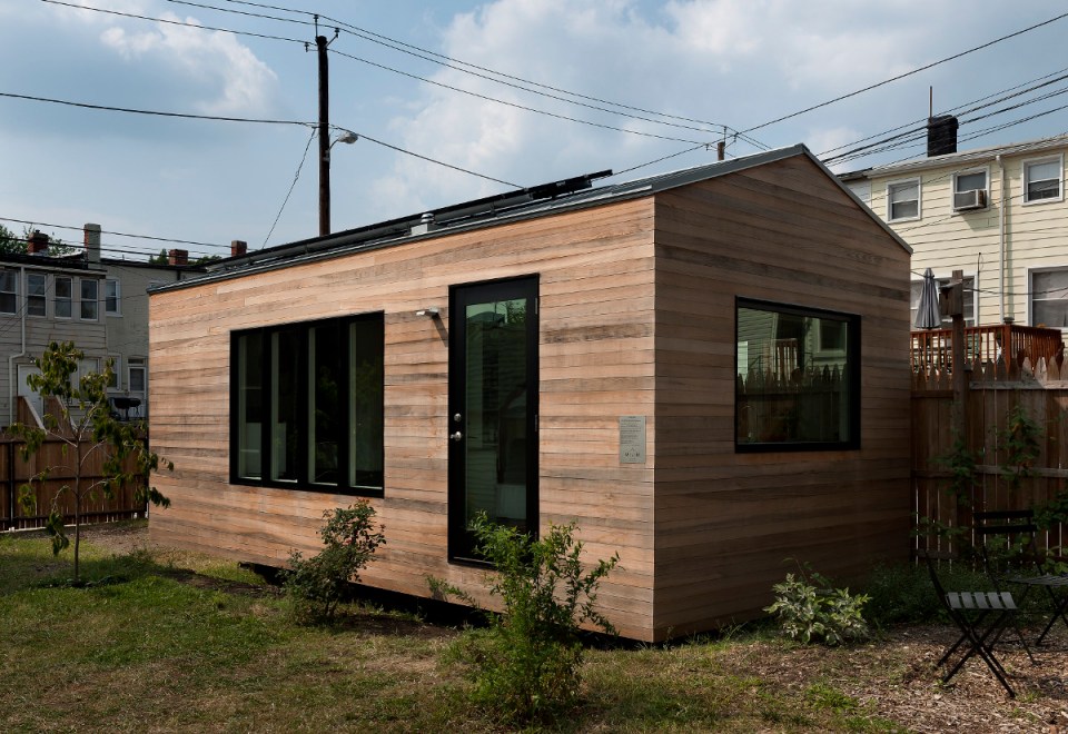 Minim House, a 242 sq ft tiny house with multi-functional furniture and a pull-out bed instead of the usual sleeping loft. | www.facebook.com/SmallHouseBliss