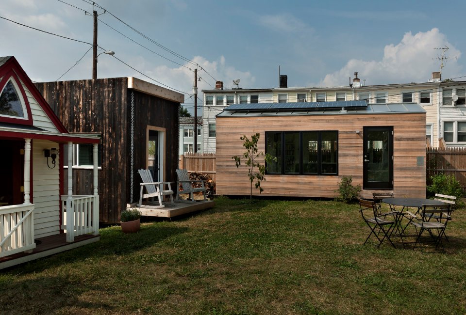 Minim House, a 242 sq ft tiny house with multi-functional furniture and a pull-out bed instead of the usual sleeping loft. | www.facebook.com/SmallHouseBliss
