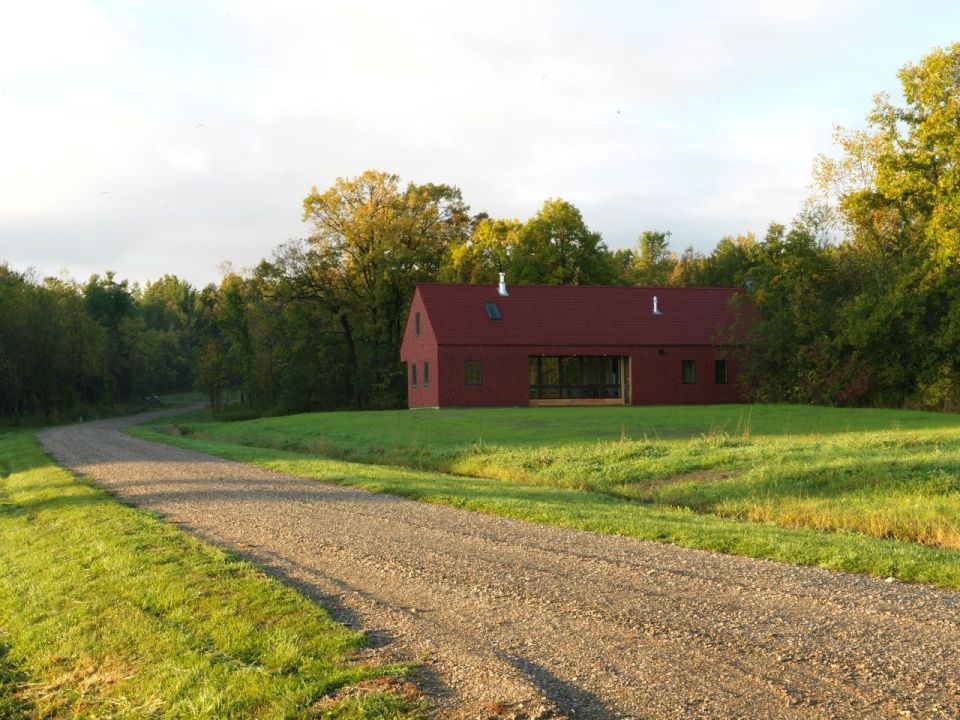 This modern farmhouse in Vermont was inspired by the area's barns and covered bridges. It has three bedrooms and a loft in 1,500 sq ft. | www.facebook.com/SmallHouseBliss