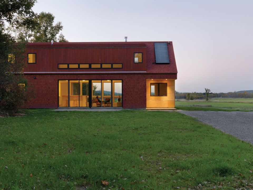 This modern farmhouse in Vermont was inspired by the area's barns and covered bridges. It has three bedrooms and a loft in 1,500 sq ft. | www.facebook.com/SmallHouseBliss