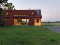 This modern farmhouse in Vermont was inspired by the area's barns and covered bridges. It has three bedrooms and a loft in 1,500 sq ft. | www.facebook.com/SmallHouseBliss