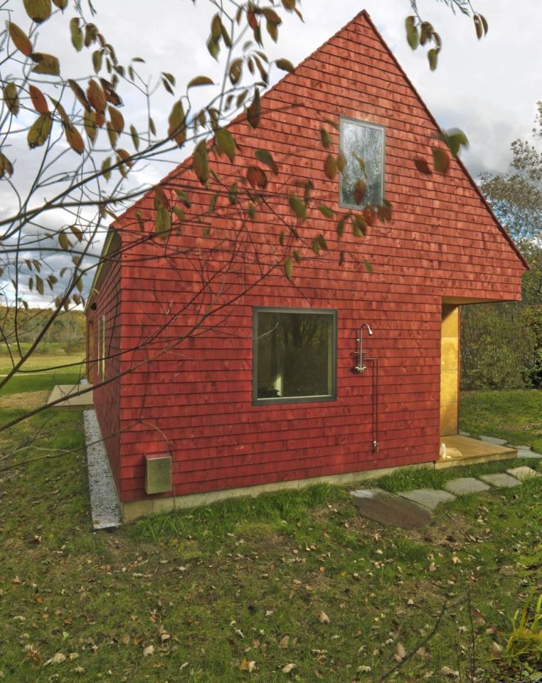This modern farmhouse in Vermont was inspired by the area's barns and covered bridges. It has three bedrooms and a loft in 1,500 sq ft. | www.facebook.com/SmallHouseBliss