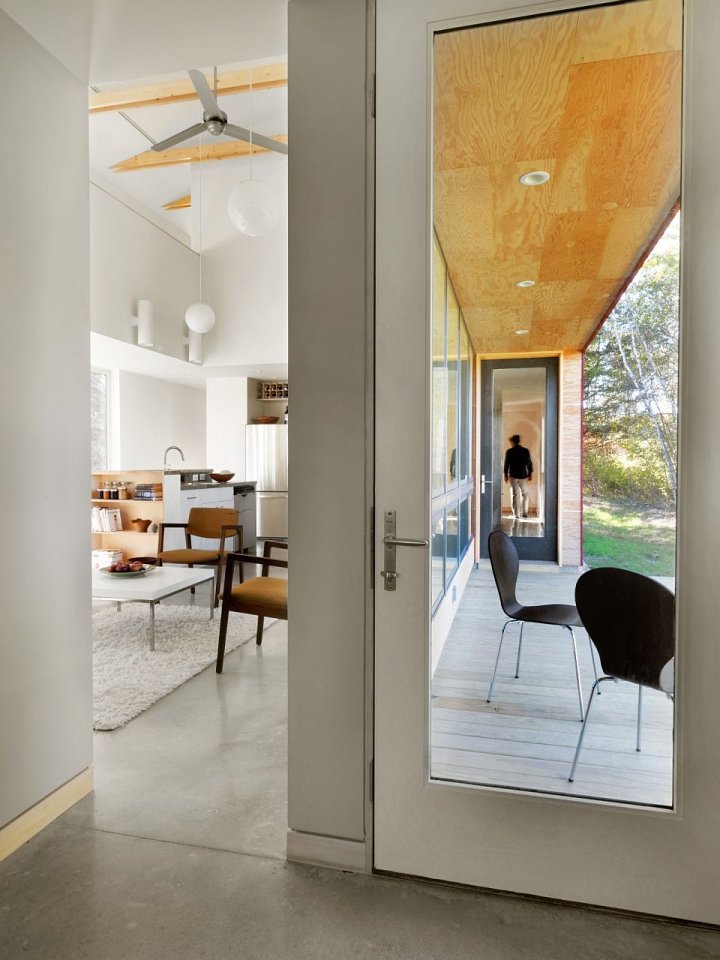 This modern farmhouse in Vermont was inspired by the area's barns and covered bridges. It has three bedrooms and a loft in 1,500 sq ft. | www.facebook.com/SmallHouseBliss