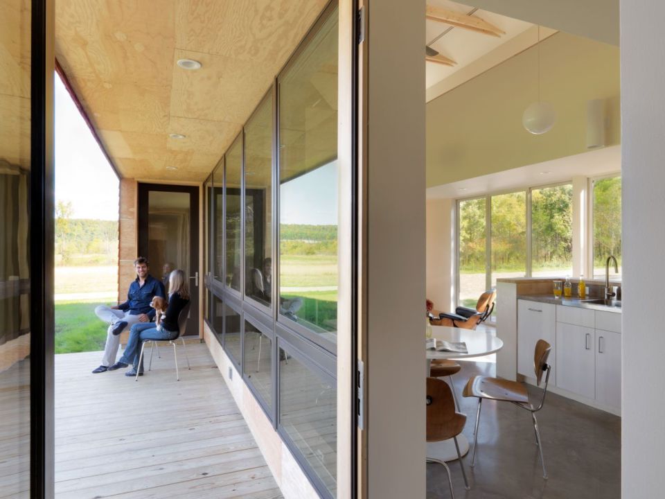 This modern farmhouse in Vermont was inspired by the area's barns and covered bridges. It has three bedrooms and a loft in 1,500 sq ft. | www.facebook.com/SmallHouseBliss