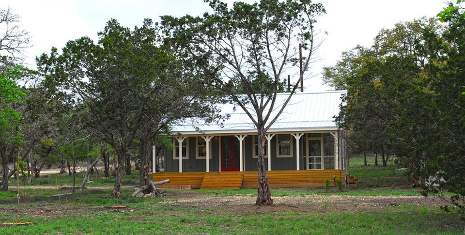 This Texas Hill Country cottage by Kanga Room Systems is a 480 sq ft studio with loft bedroom plus 432 sq ft of porches | www.facebook.com/SmallHouseBliss