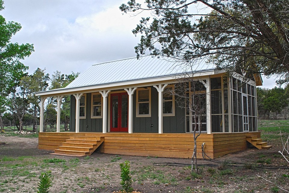 This Texas Hill Country cottage by Kanga Room Systems is a 480 sq ft studio with loft bedroom plus 432 sq ft of porches | www.facebook.com/SmallHouseBliss