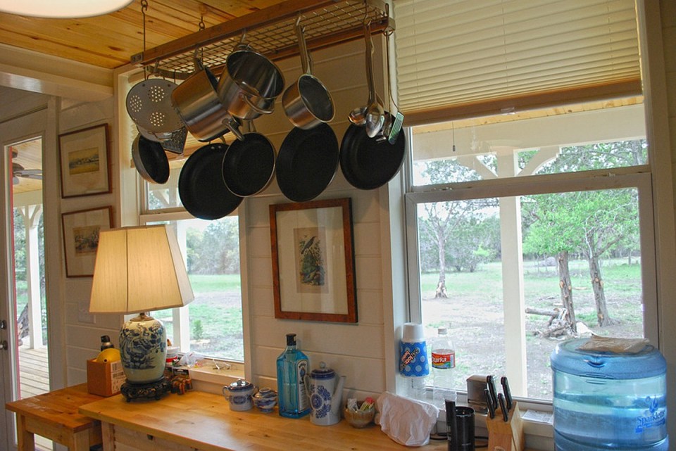 This Texas Hill Country cottage by Kanga Room Systems is a 480 sq ft studio with loft bedroom plus 432 sq ft of porches | www.facebook.com/SmallHouseBliss