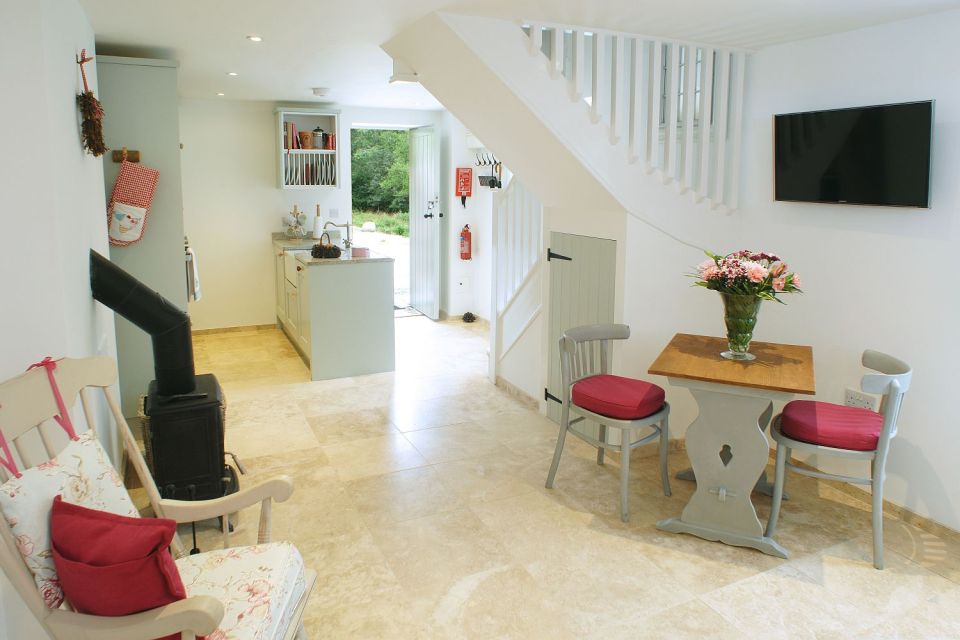 This restored worker's cottage dating from the mid-19th century has 590 sq ft on the main floor and a bedroom in the attic. | www.facebook.com/SmallHouseBliss