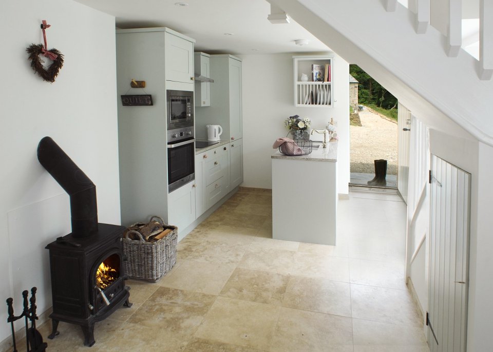 This restored worker's cottage dating from the mid-19th century has 590 sq ft on the main floor and a bedroom in the attic. | www.facebook.com/SmallHouseBliss