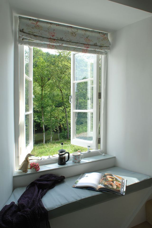 This restored worker's cottage dating from the mid-19th century has 590 sq ft on the main floor and a bedroom in the attic. | www.facebook.com/SmallHouseBliss