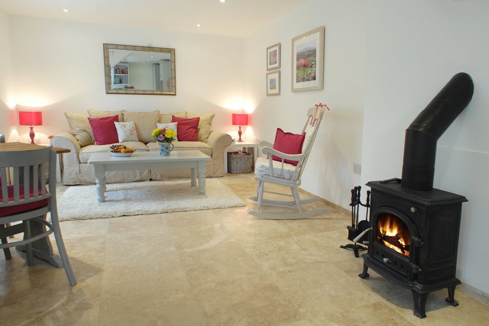 This restored worker's cottage dating from the mid-19th century has 590 sq ft on the main floor and a bedroom in the attic. | www.facebook.com/SmallHouseBliss