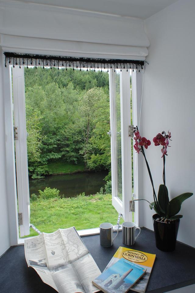 This restored worker's cottage dating from the mid-19th century has 590 sq ft on the main floor and a bedroom in the attic. | www.facebook.com/SmallHouseBliss