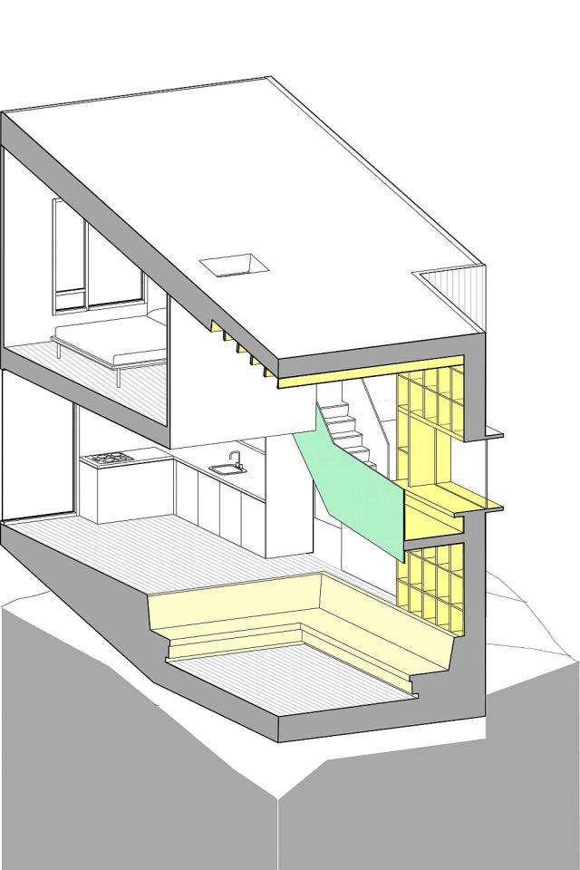 This vertically-oriented house with 1 bedroom and a small loft in 872 sq ft uses a split-level design to step down its steep site. | www.facebook.com/SmallHouseBliss