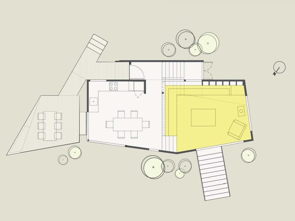 This vertically-oriented house with 1 bedroom and a small loft in 872 sq ft uses a split-level design to step down its steep site. | www.facebook.com/SmallHouseBliss