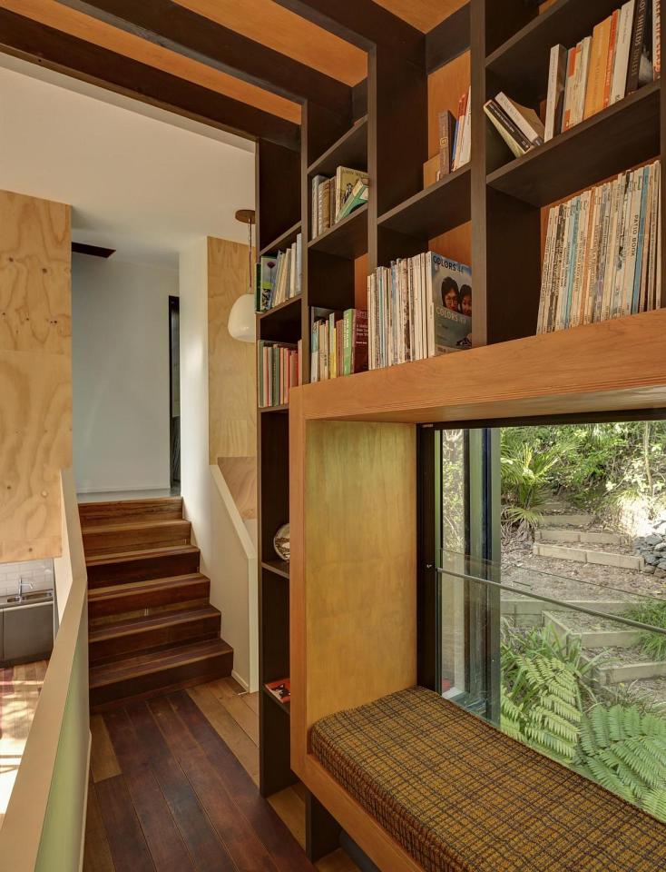This vertically-oriented house with 1 bedroom and a small loft in 872 sq ft uses a split-level design to step down its steep site. | www.facebook.com/SmallHouseBliss