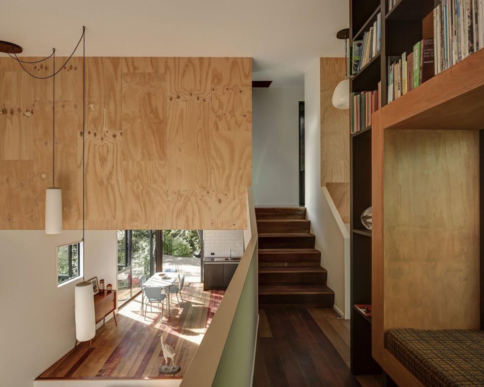 This vertically-oriented house with 1 bedroom and a small loft in 872 sq ft uses a split-level design to step down its steep site. | www.facebook.com/SmallHouseBliss