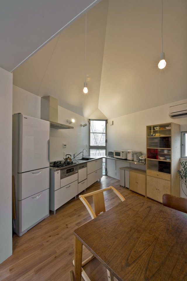 This 2-bedroom house on a tiny sliver of a site seems larger than its 595 sq ft. | www.facebook.com/SmallHouseBliss