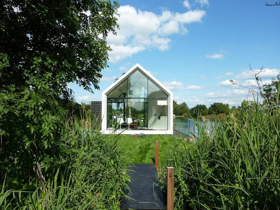 This tiny 226 sq ft lake house opens to the outdoors with a folding wall. 2by4-architects has also designed a prefab version. | www.facebook.com/SmallHouseBliss