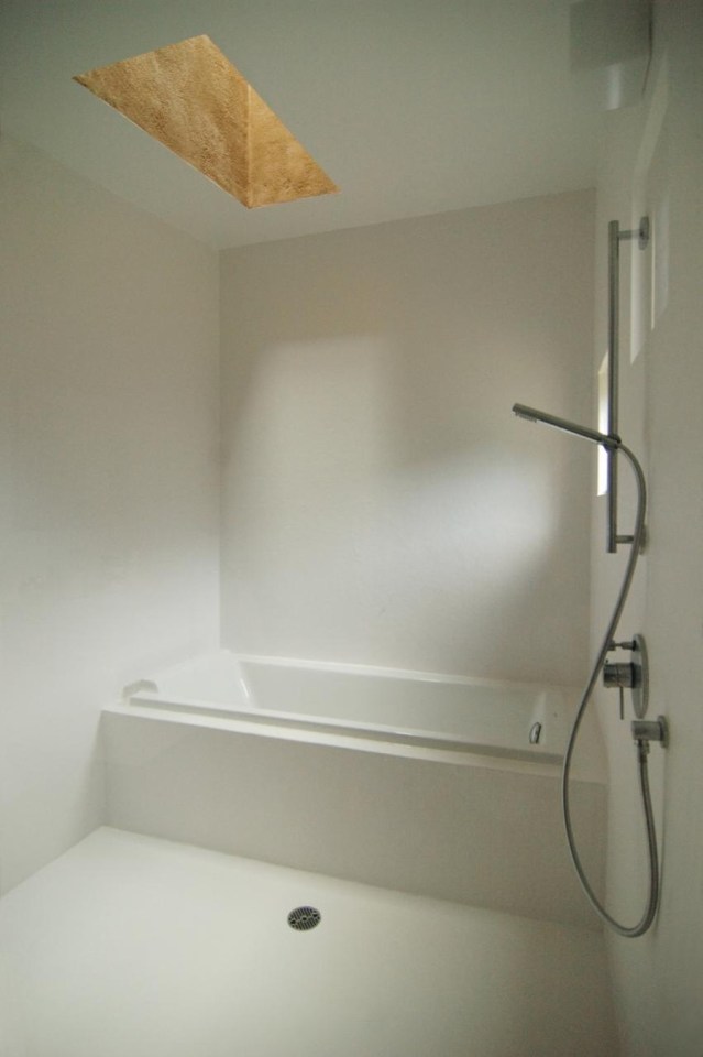 This "one room" weekend house has sleeping alcoves off the open living area, a green roof and earth-plastered walls. | www.facebook.com/SmallHouseBliss