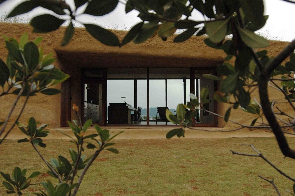 This "one room" weekend house has sleeping alcoves off the open living area, a green roof and earth-plastered walls. | www.facebook.com/SmallHouseBliss