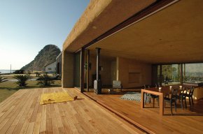 This "one room" weekend house has sleeping alcoves off the open living area, a green roof and earth-plastered walls. | www.facebook.com/SmallHouseBliss