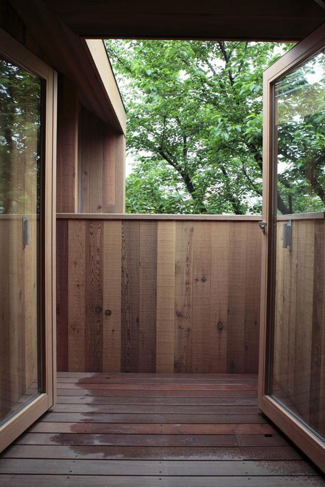 This wood family house has 4 bedrooms in a 1,359 sq ft cross-shaped floor plan. | www.facebook.com/SmallHouseBliss