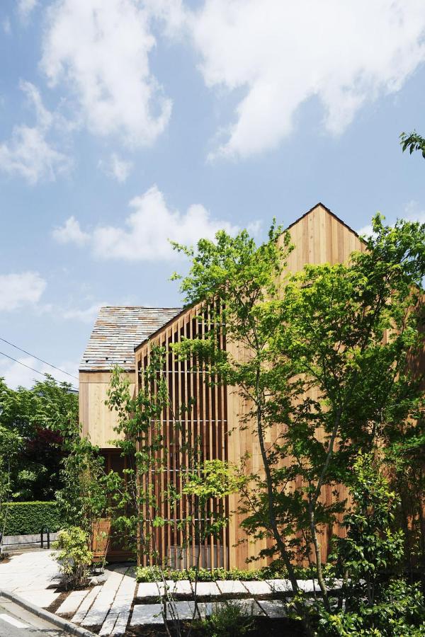 This wood family house has 4 bedrooms in a 1,359 sq ft cross-shaped floor plan. | www.facebook.com/SmallHouseBliss