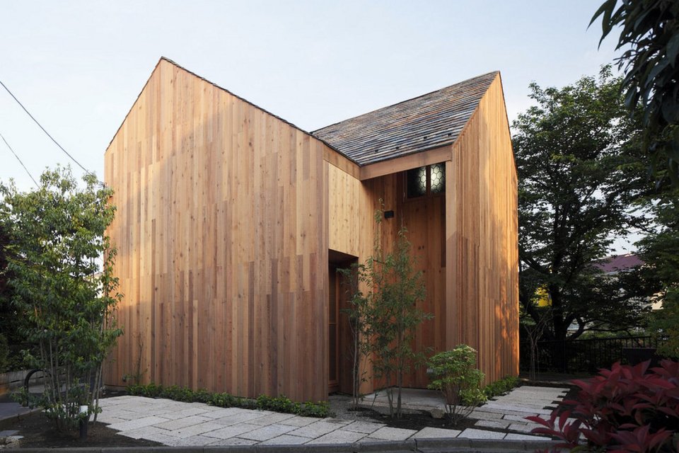 This wood family house has 4 bedrooms in a 1,359 sq ft cross-shaped floor plan. | www.facebook.com/SmallHouseBliss