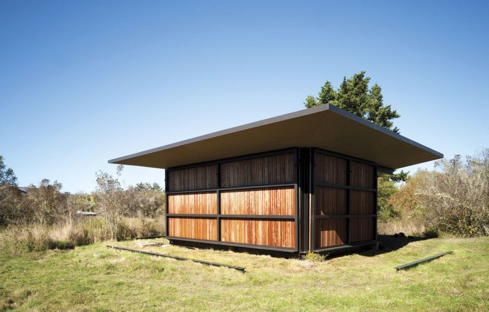 This modern cabin by Olson Kundig Architects is open to nature with glass walls on three sides. It has 500 sq ft of studio living space. | www.facebook.com/SmallHouseBliss