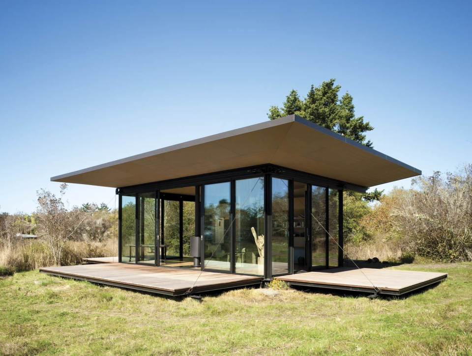 This modern cabin by Olson Kundig Architects is open to nature with glass walls on three sides. It has 500 sq ft of studio living space. | www.facebook.com/SmallHouseBliss