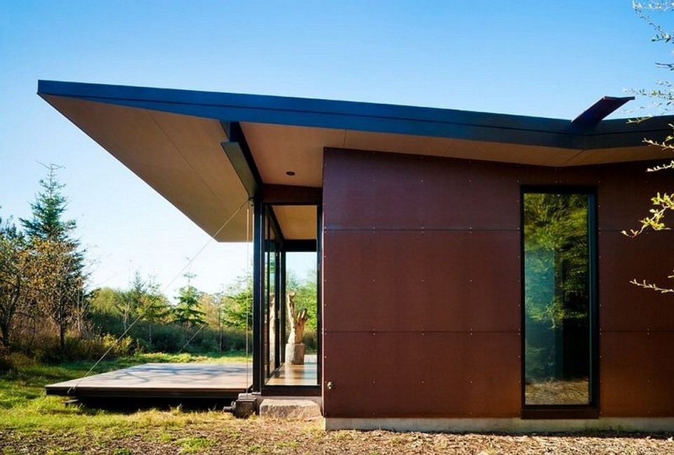 This modern cabin by Olson Kundig Architects is open to nature with glass walls on three sides. It has 500 sq ft of studio living space. | www.facebook.com/SmallHouseBliss