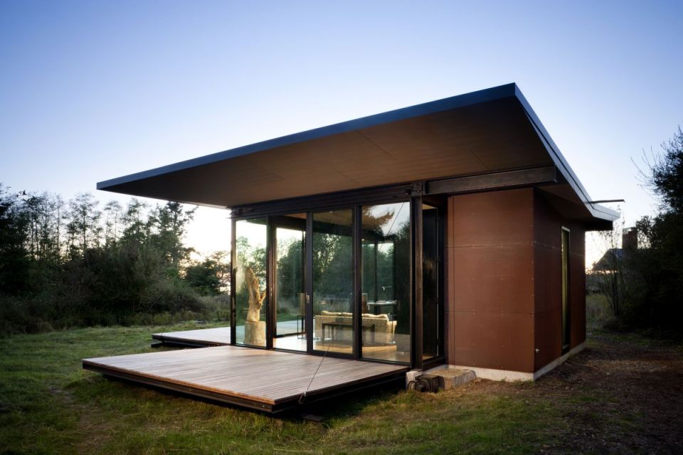 This modern cabin by Olson Kundig Architects is open to nature with glass walls on three sides. It has 500 sq ft of studio living space. | www.facebook.com/SmallHouseBliss