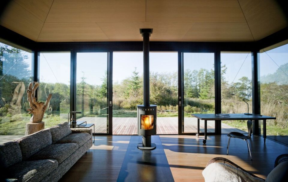 This modern cabin by Olson Kundig Architects is open to nature with glass walls on three sides. It has 500 sq ft of studio living space. | www.facebook.com/SmallHouseBliss