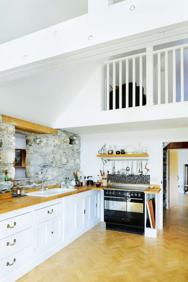 An old stone horse barn in Scotland was converted into this small house with 1 bedroom and a large loft in 1,291 sq ft. | www.facebook.com/SmallHouseBliss