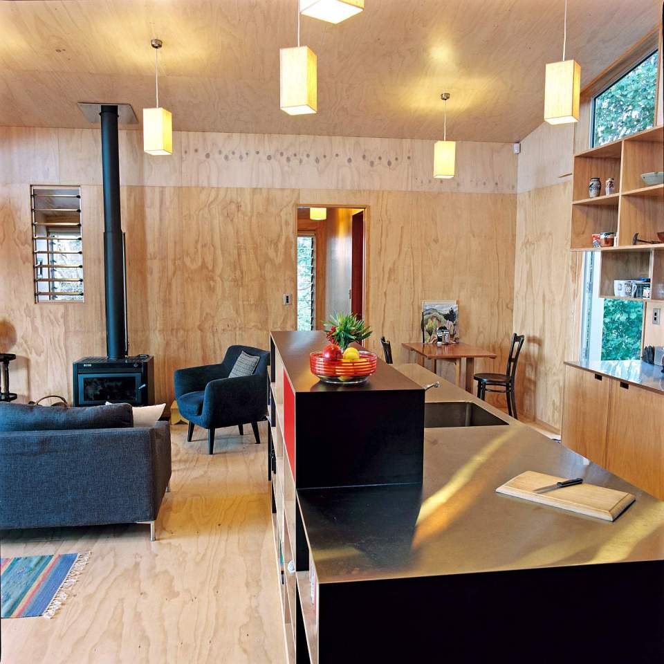 This "bach" (a simple, inexpensive vacation house) for a New Zealand family has 4 bedrooms in 1,507 sq ft. Designed by architects Bonnifait + Giesen, Atelierworkshop. | www.facebook.com/SmallHouseBliss