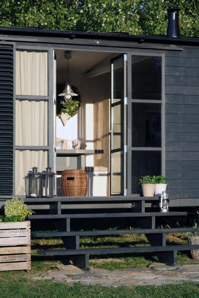 A modern version of the traditional wagon dwelling. It has a full kitchen, 3-piece bath and built-in bed in 258 sq ft. | www.facebook.com/SmallHouseBliss