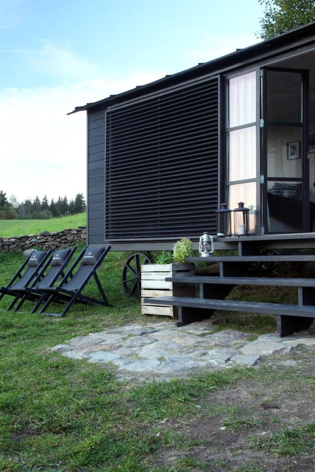 A modern version of the traditional wagon dwelling. It has a full kitchen, 3-piece bath and built-in bed in 258 sq ft. | www.facebook.com/SmallHouseBliss