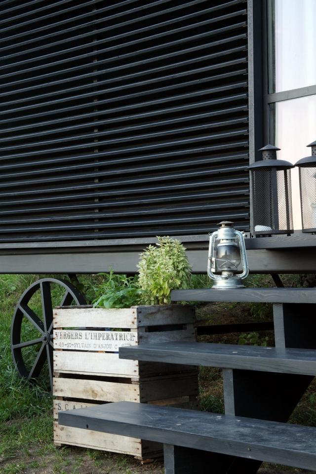 A modern version of the traditional wagon dwelling. It has a full kitchen, 3-piece bath and built-in bed in 258 sq ft. | www.facebook.com/SmallHouseBliss